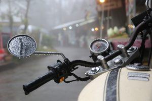 closeup-of-vintage-motorcycle-riding-in-the-rain