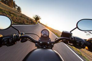 view-over-handlebars-of-a-motorcycle