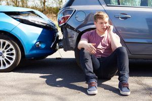 driver-making-phone-call-after-traffic-accident