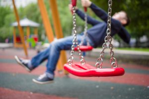 set-of-red-chain-swings-on-modern-kids-playground
