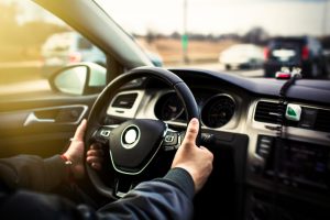 man driving a car