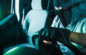 veiled man driving to avoiding carjacking