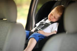 child sleeping in car