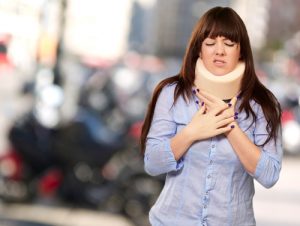 woman wearing a neck brace after a car accident