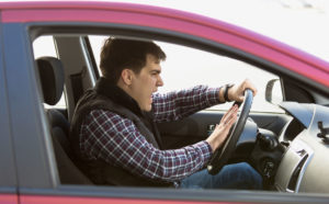 man driving aggressively