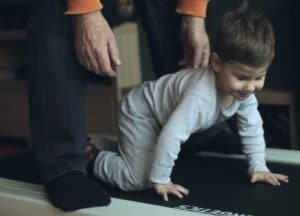 baby crawling on a treadmill